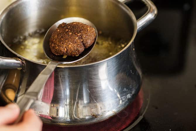 Falafel patties frying in oil 