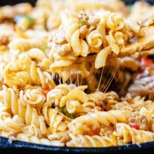 One-Skillet Macaroni and Cheese with Italian Sausage and Bell Peppers | The Mediterranean Dish. Try this delicious Italian twist on macaroni and cheese! The perfect comfort skillet meal; comes together in minutes!