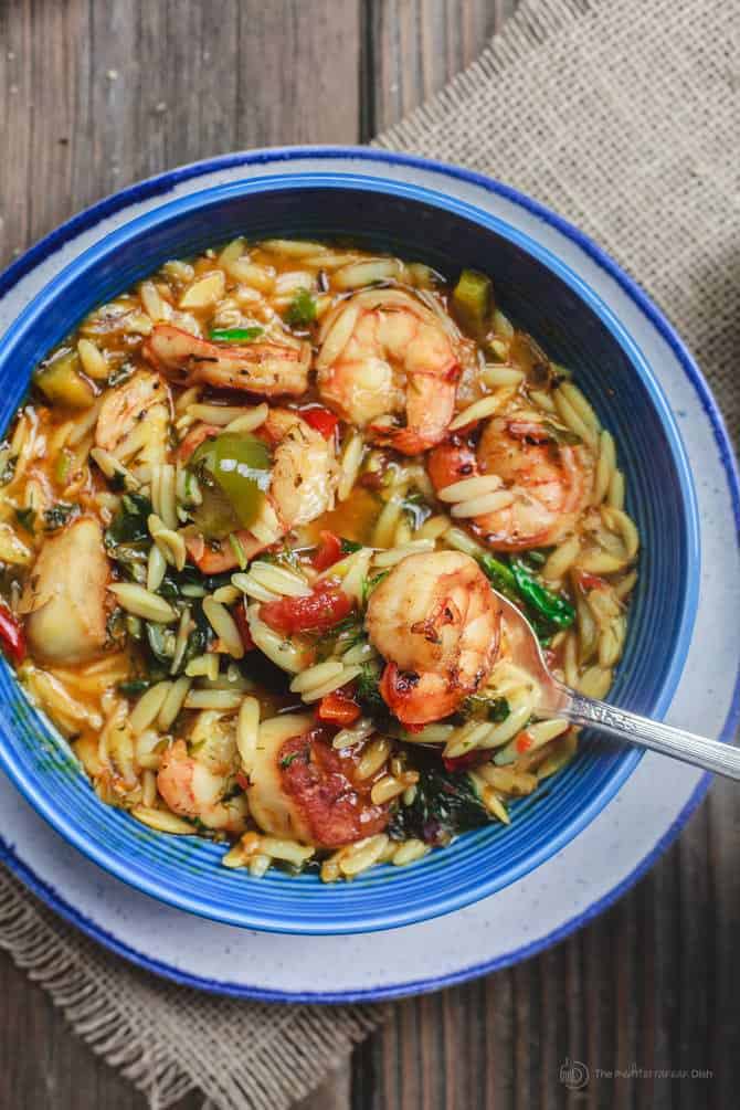 Mediterranean Shrimp Orzo Soup | The Mediterranean Dish. A hearty and healthy orzo soup with vegetables and shrimp. Fresh parsley, dill and oregano give it a wonderful Italian flavor. See this Mediterranean recipe on TheMediterraneanDish.com