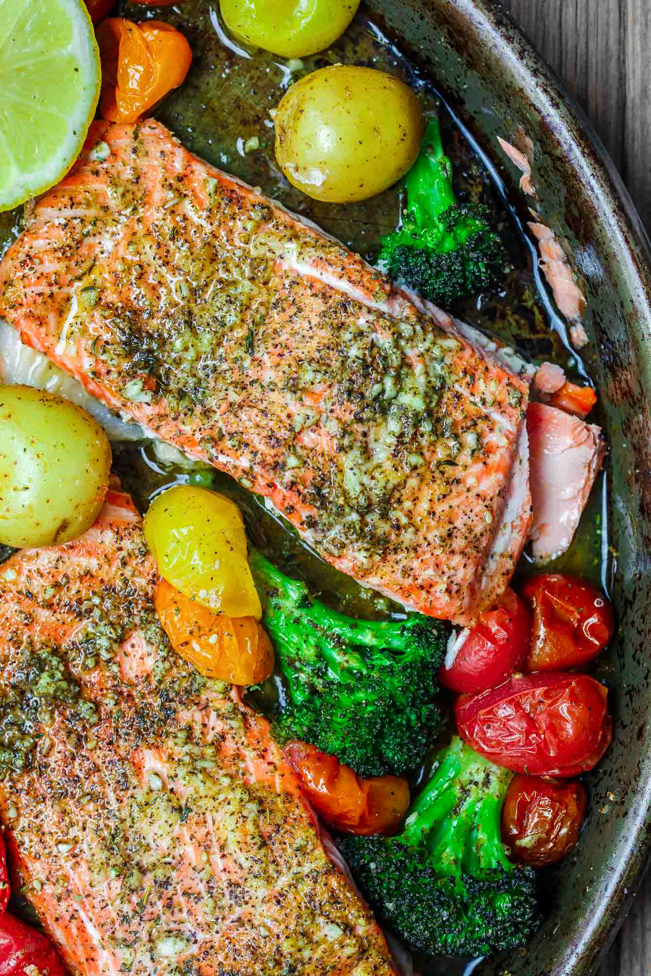 Za'atar salmon with broccoli, grape tomatoes olive oil and lemon wedge
