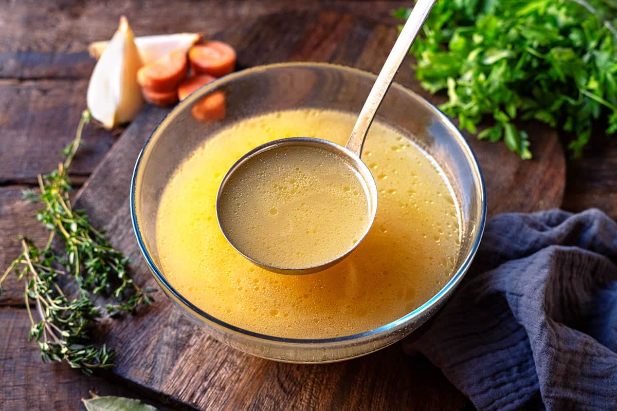 How to make Homemade Chicken Stock from Freezer Scraps - Bowl of Delicious