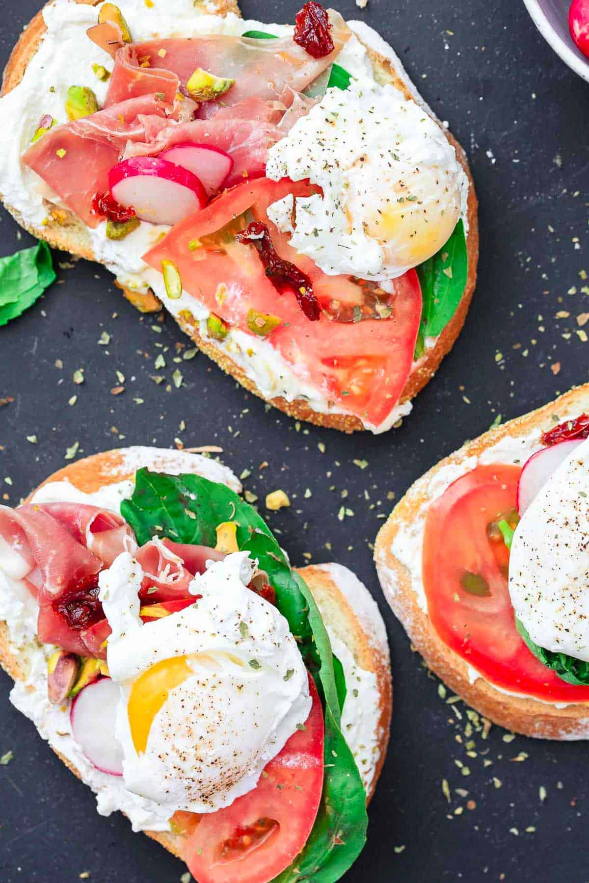 A close up overhead photo of 2 open faced sandwiches.