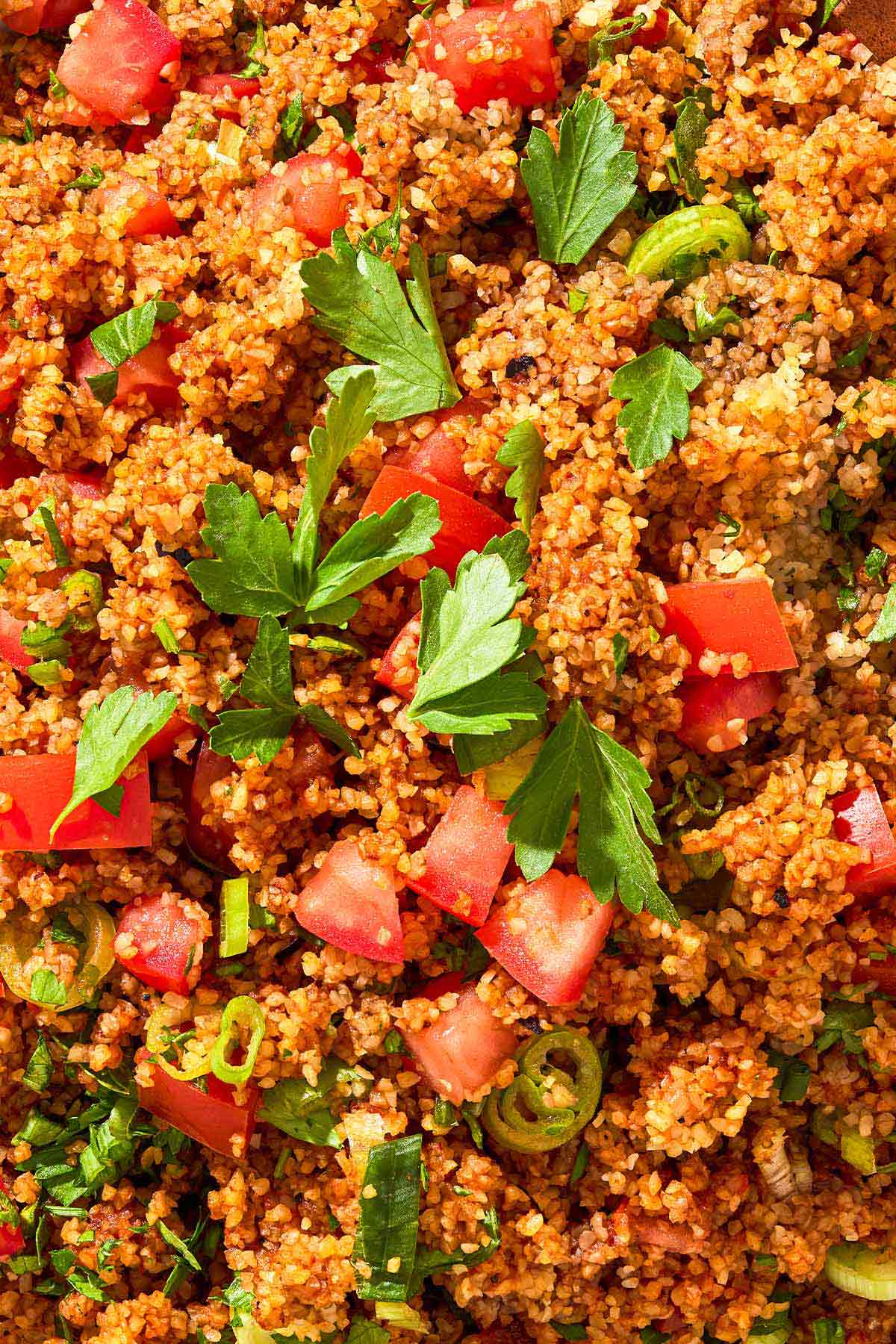 An overhead close up photo of kisir Turkish bulgur salad.