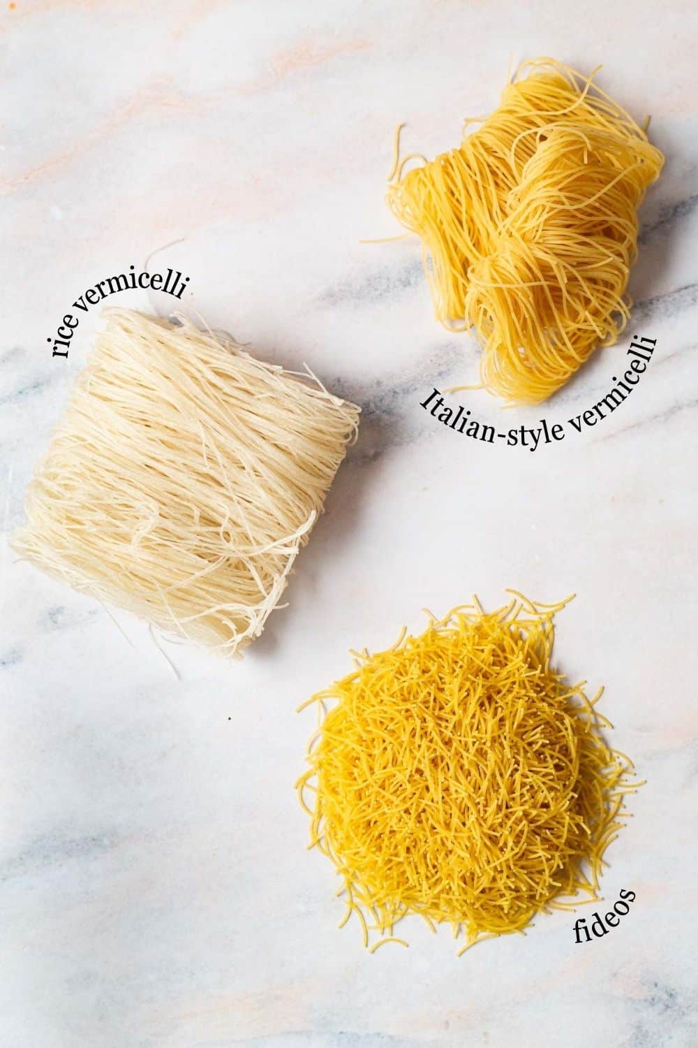 An overhead photo of rice vermicelli, Italian-style vermicelli and fideos.