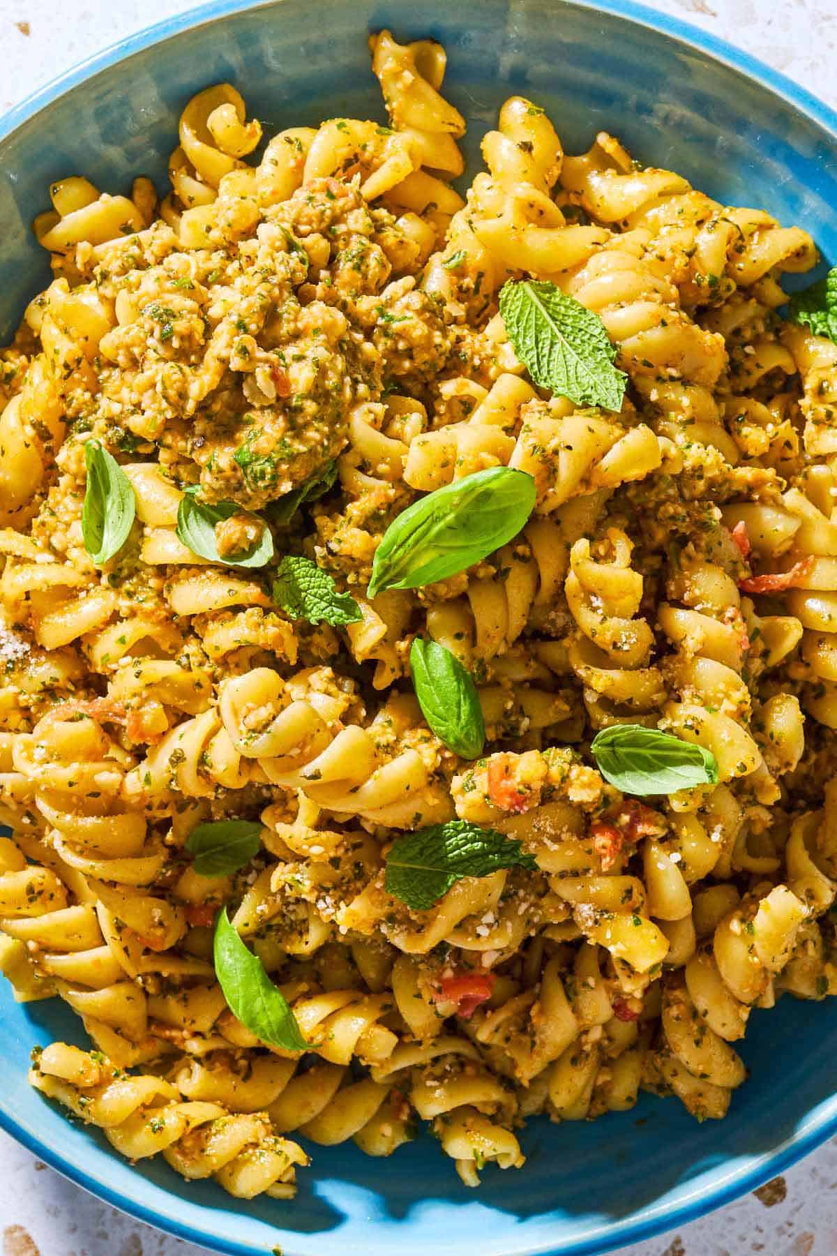 A close up of pesto alla trapanese pasta in a bowl.