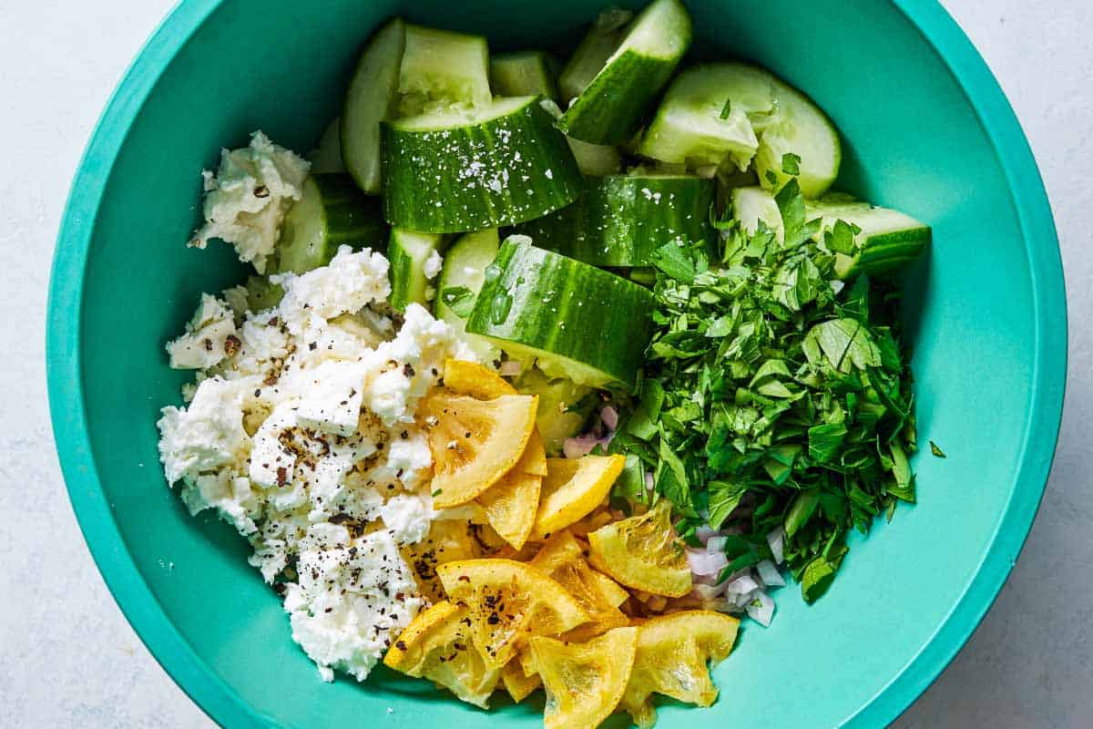 The ingredients for smashed cucumber salad in a bowl just before being mixed together.