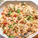 A white bowl filled with chickpea chicken salad.