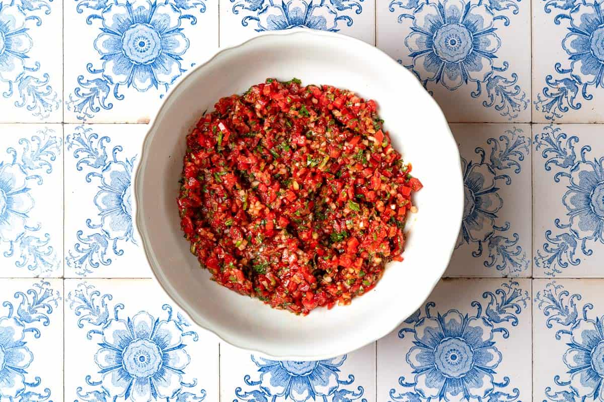 The ezme turkish salsa in a mixing bowl.