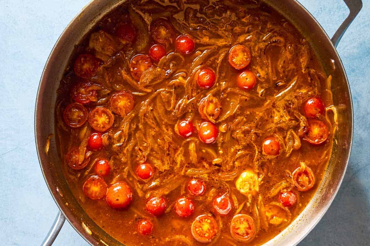 An overhead photo of the tomato sauce for the borani kadoo in a skillet.