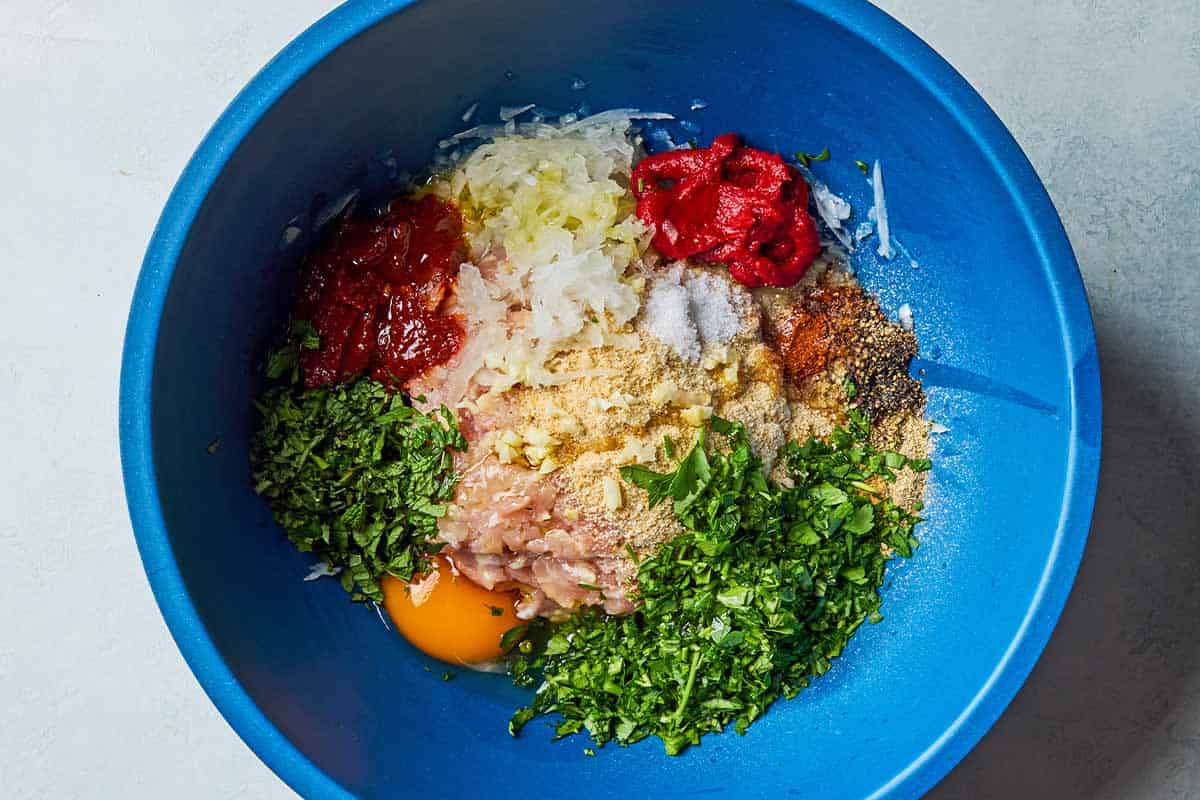 Ingredients for the kebab mixture in a bowl before being mixed together.