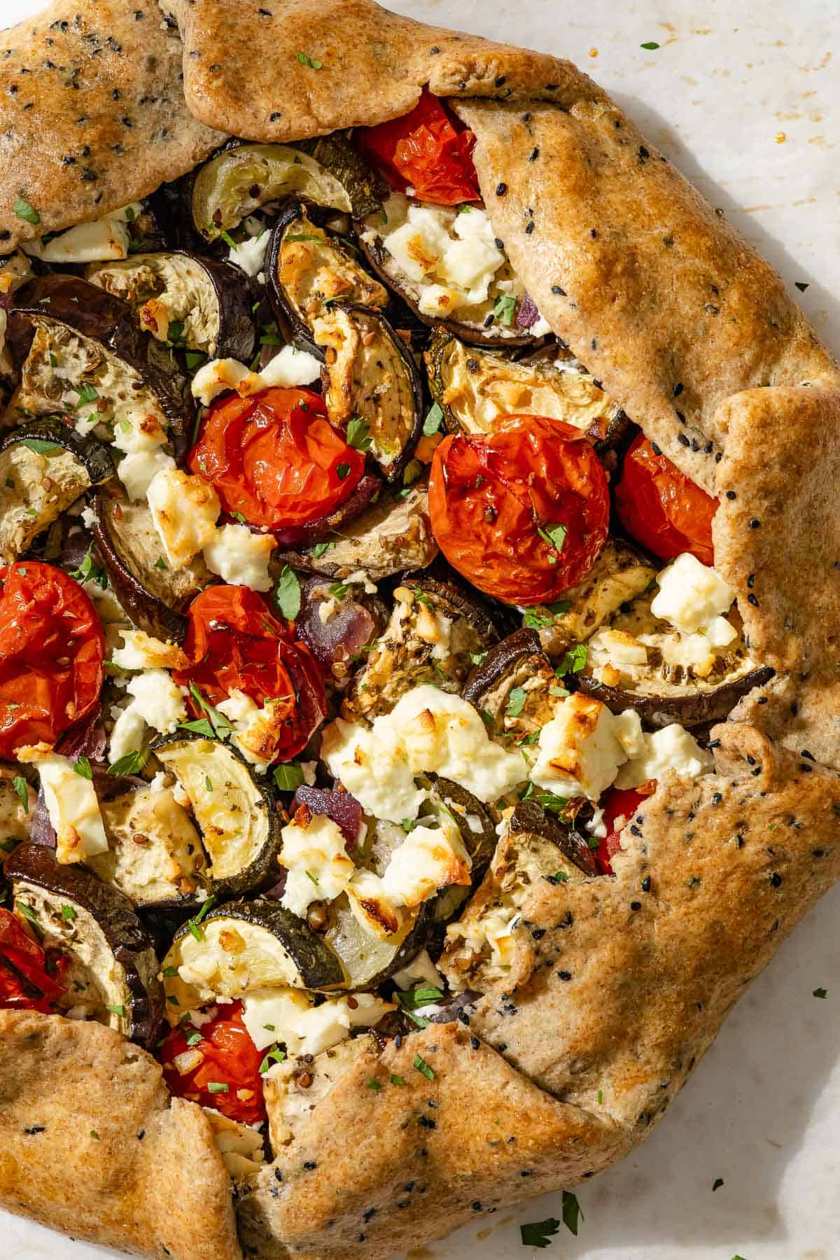 A close up of a whole savory galette.