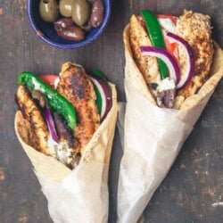 Chicken gyro wraps served with black and green olives.