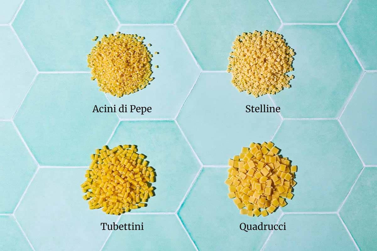 Graphic image labeling 4 types of pasta, with acini di pepe, stelline, tubettini, and quadrucci.