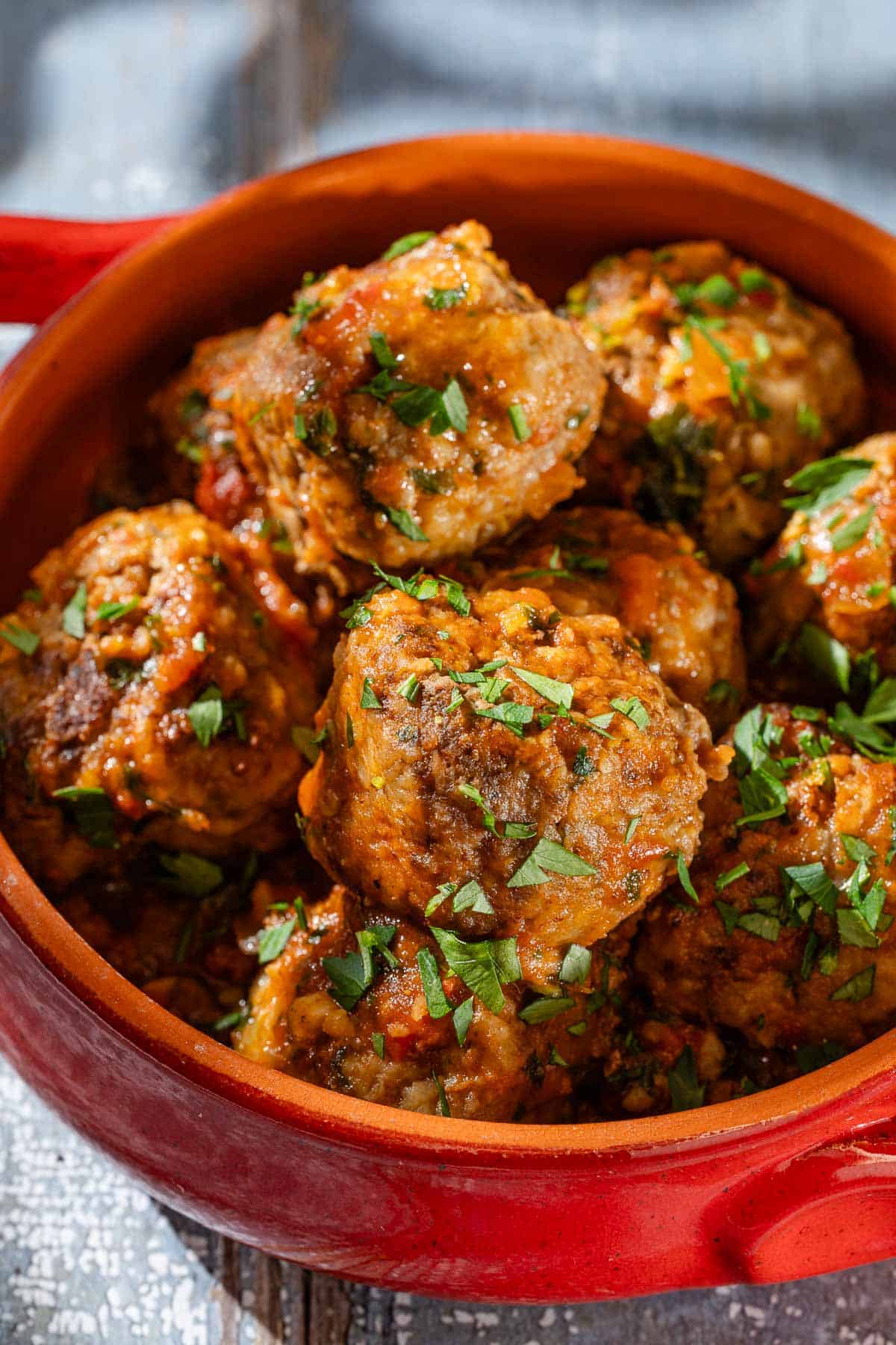 A close up of Albóndigas (Spanish meatballs) in a small bowl.