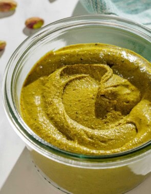 A close up of pistachio butter in a small bowls.