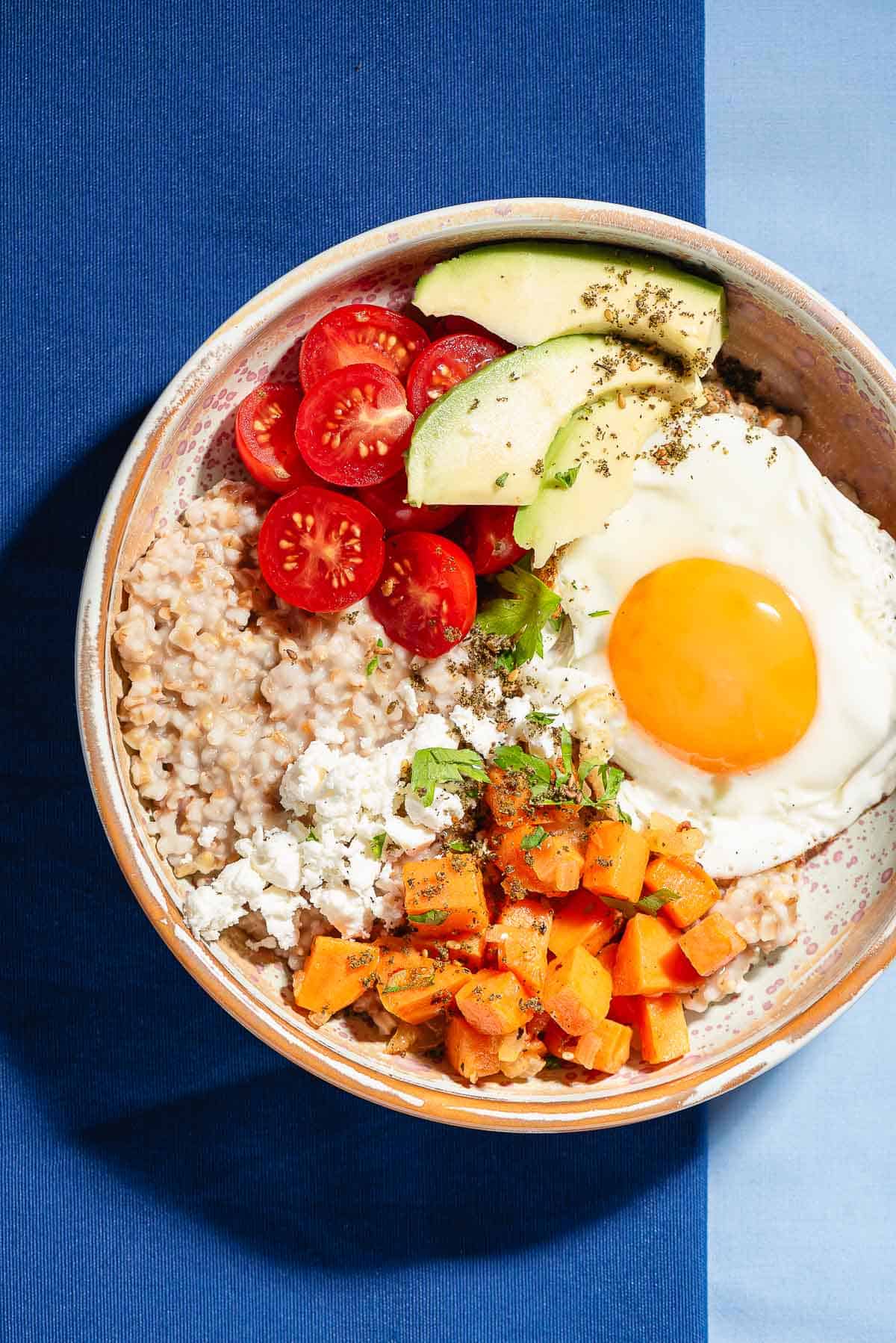 An overhead photo of a savory oatmeal bowl.