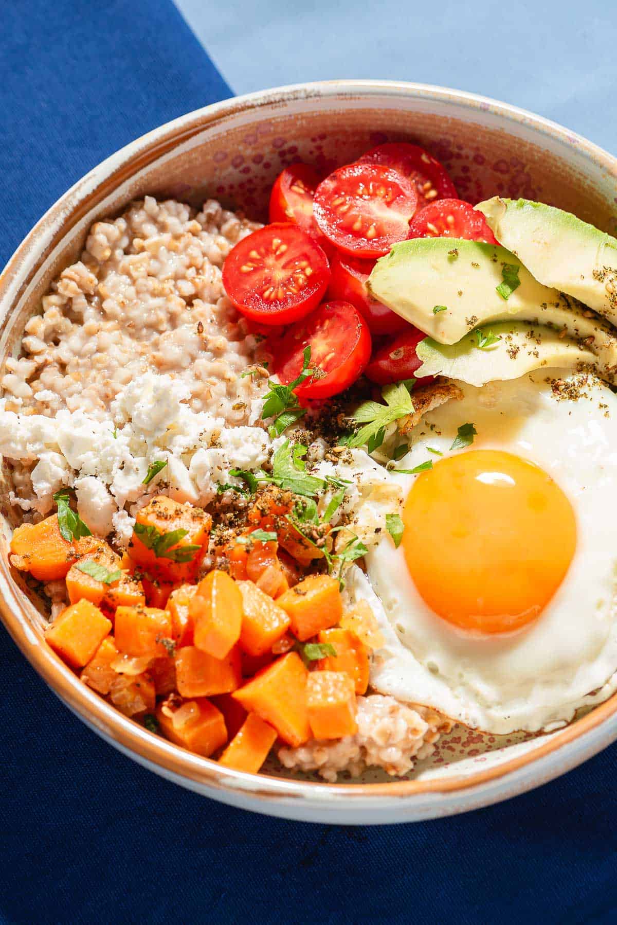 A close up of a savory oatmeal bowl.