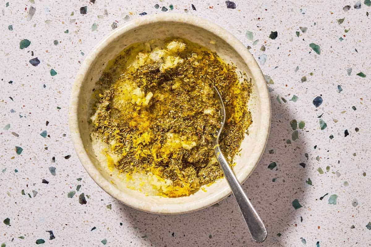 An overhead photo of the bowl of the rub with a spoon.