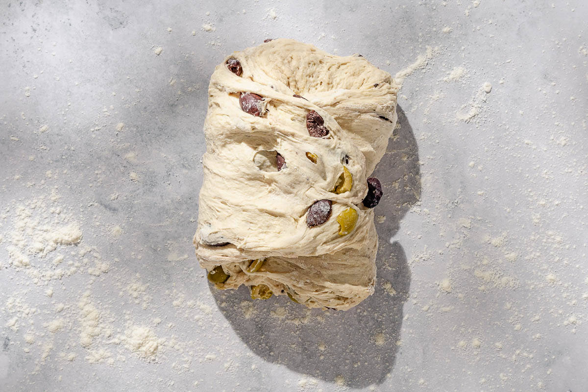 An overhead photo of the olive bread dough.