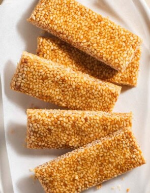 Several pieces of greek sesame candy on a plate.