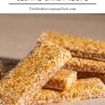 Sesame candy sticks (pasteli) arranged in a haphazard pile.