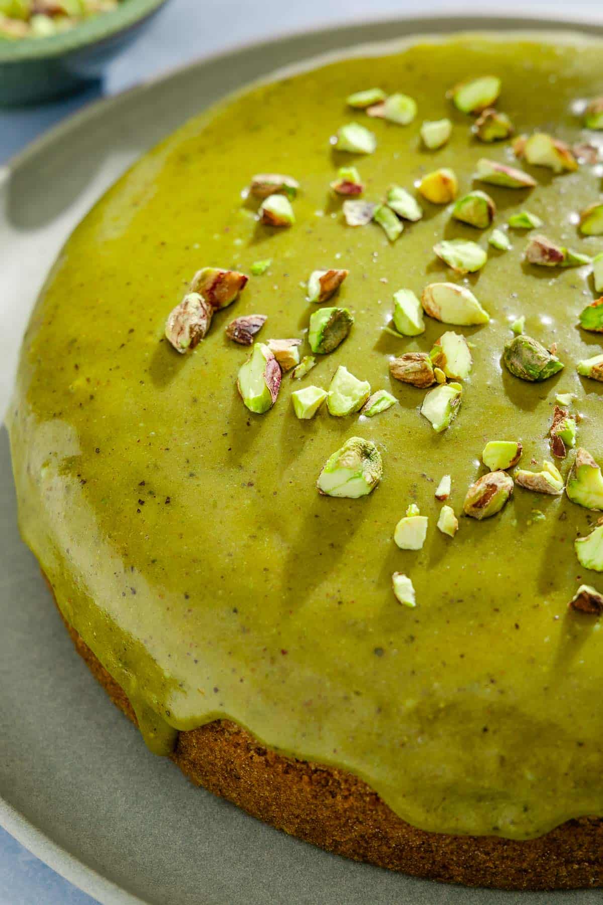 A close up of the pistachio cake on a platter.