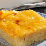 A close up of a piece of portokalopita greek orange cake on a plate.