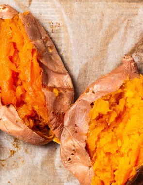 An overhead close up photo of 4 roasted sweet potatoes split open.