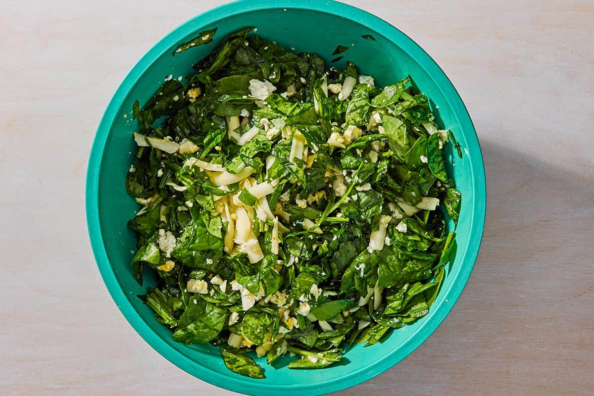 An overhead photo of the filling for the borek in a bowl after being mixed together.