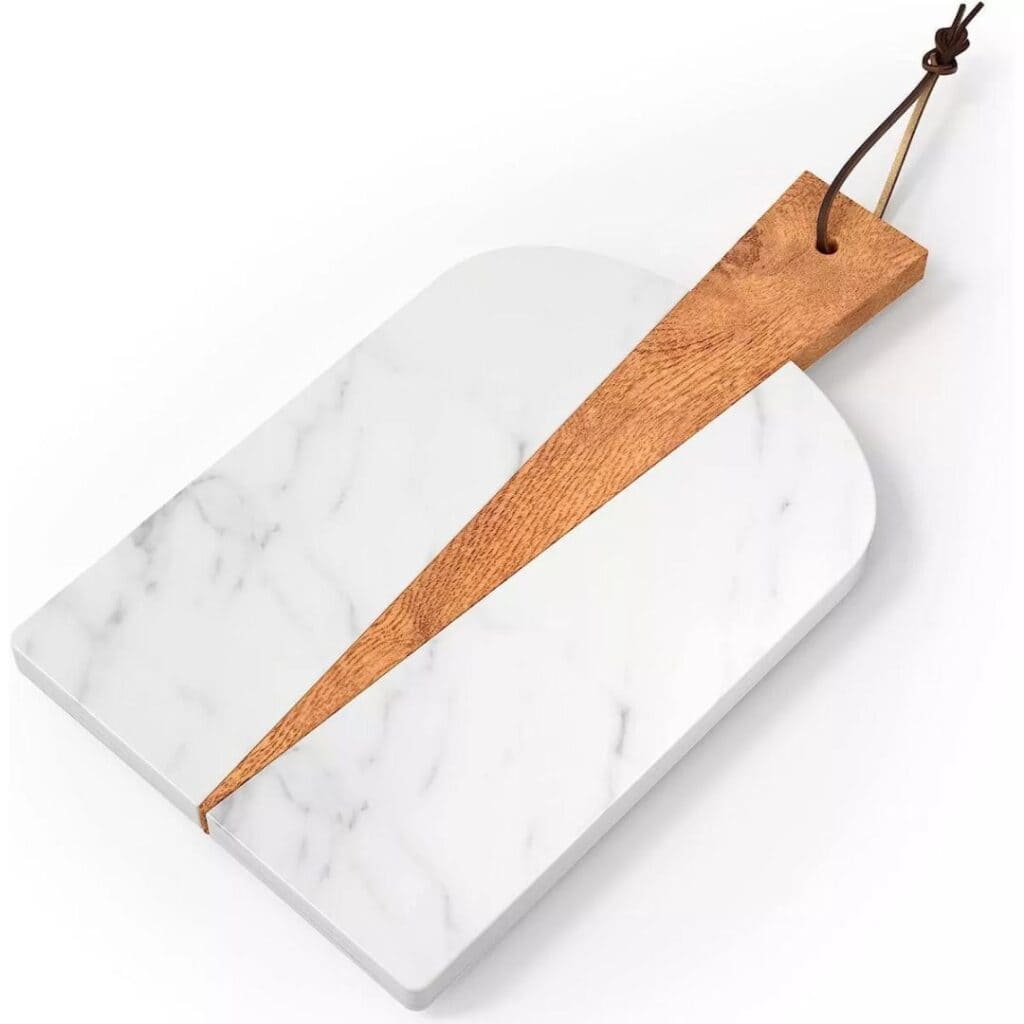 Image of a cutting board that is part wood and part marble. 