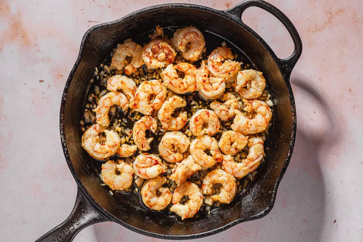 An overhead photo of the shrimp being cooked in a skillet.