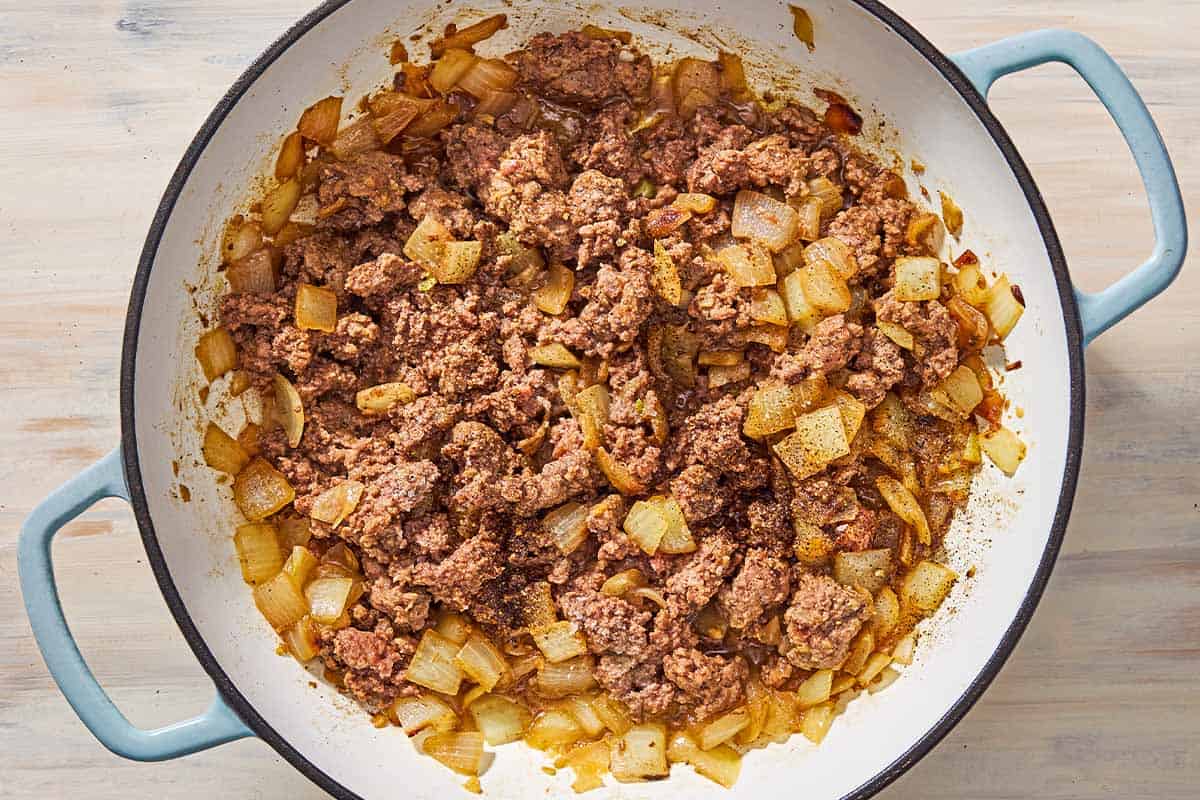 An overhead photo of the cooked chopped onions and ground beef in the skillet.