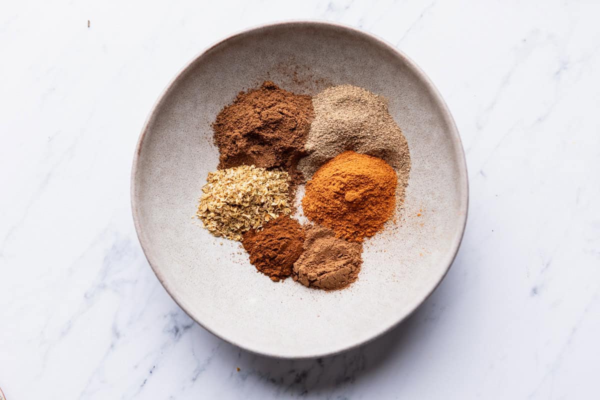 The spices for the quinoa chicken bowl in a bowl before being mixed together.