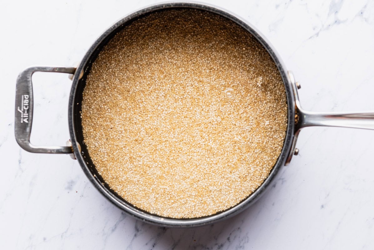 Quinoa cooking in a saucepan.