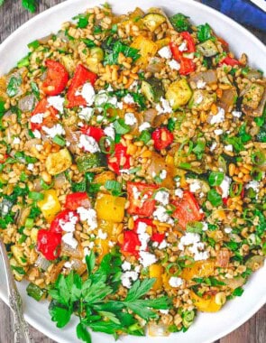 The roasted vegetables barley recipe In a bowl with a fork.