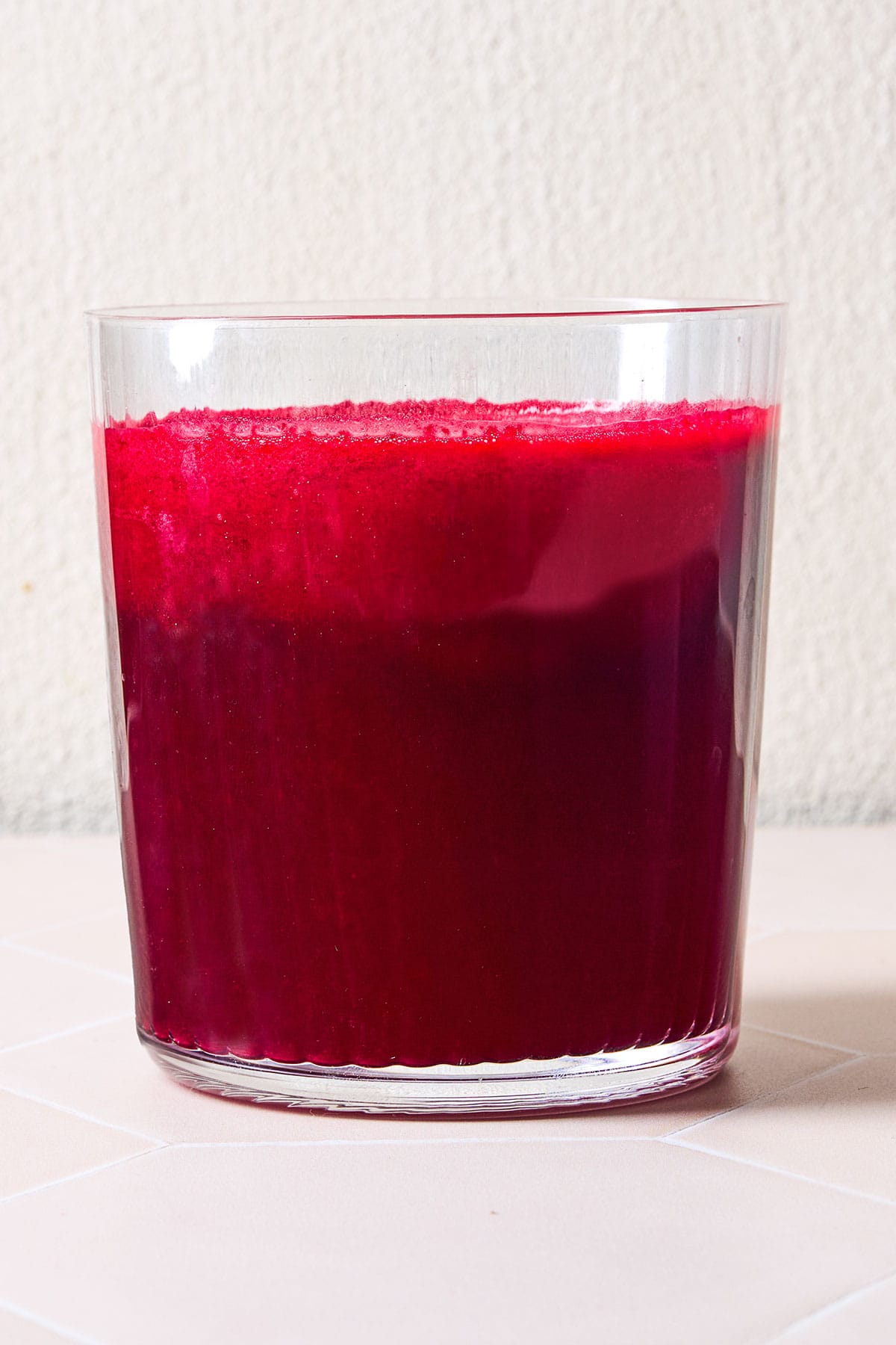 Beet juice in a glass cup.