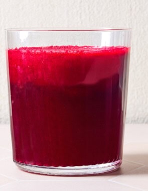 Beet juice in a glass cup.