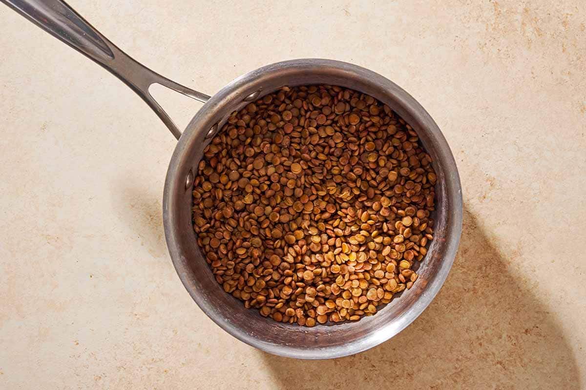 Cooked lentils in a saucepan.