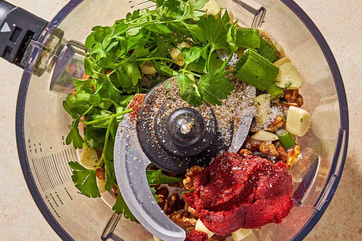 The ingredients for the lentil burgers just before being mixed together in the bowl of a food processor fitted with a blade.