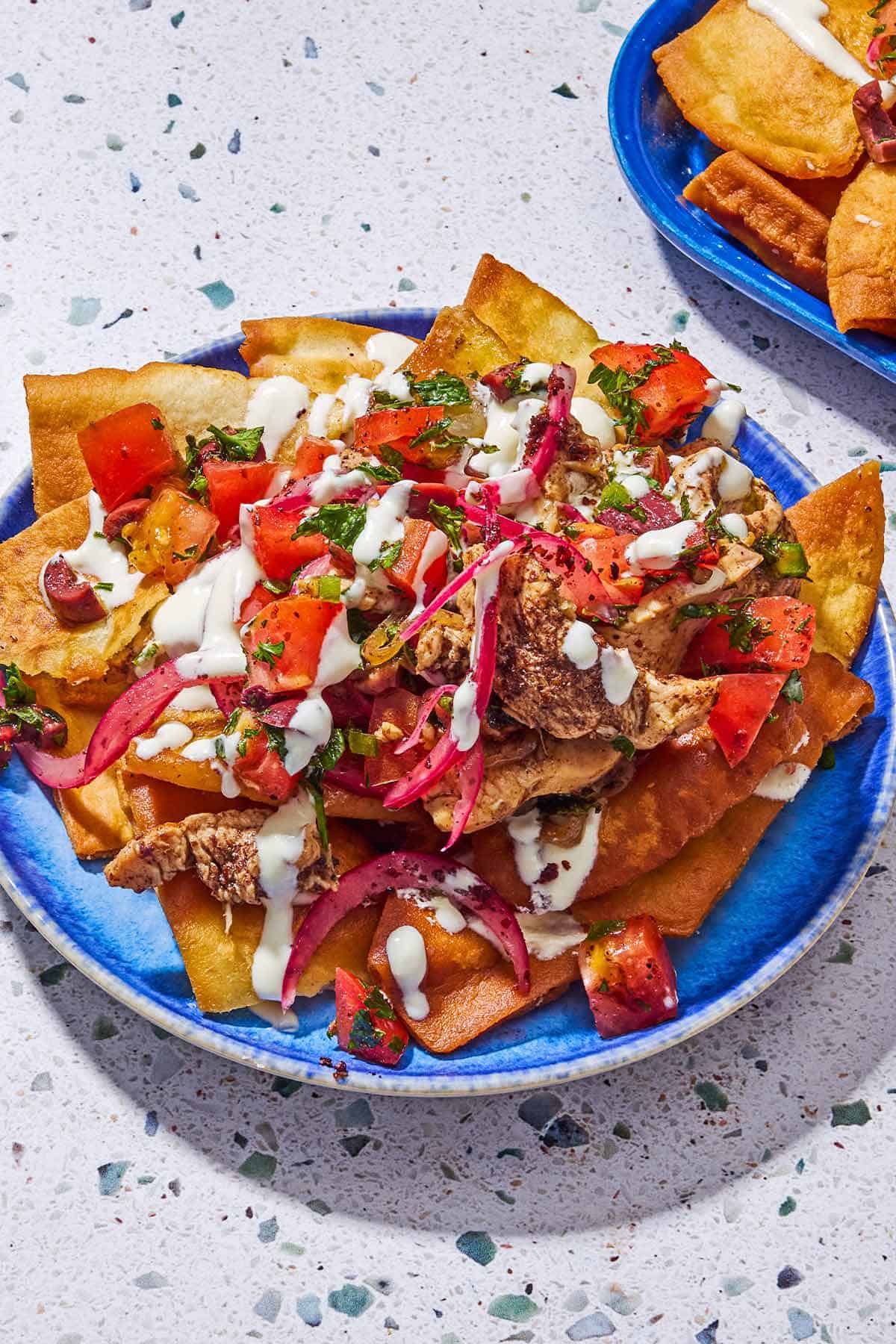 A serving of the chicken nachos recipe on a plate.