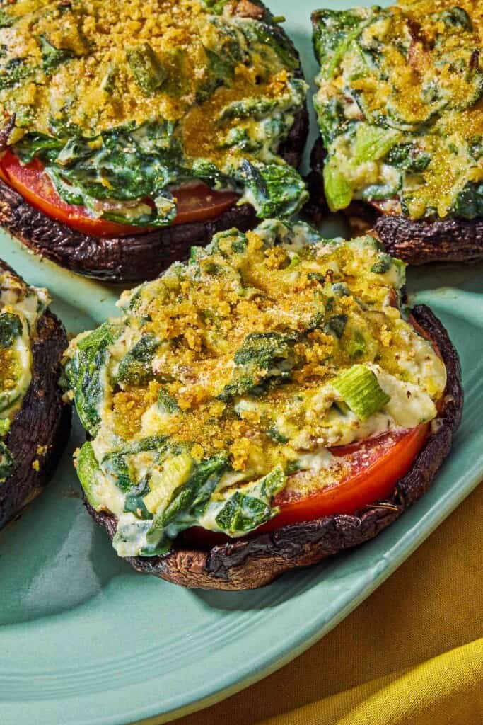 Stuffed portobello mushrooms on a platter.