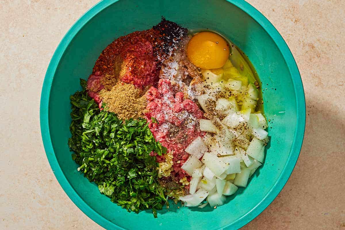 The ingredients for the turkish meatballs in a bowl just before being mixed together.